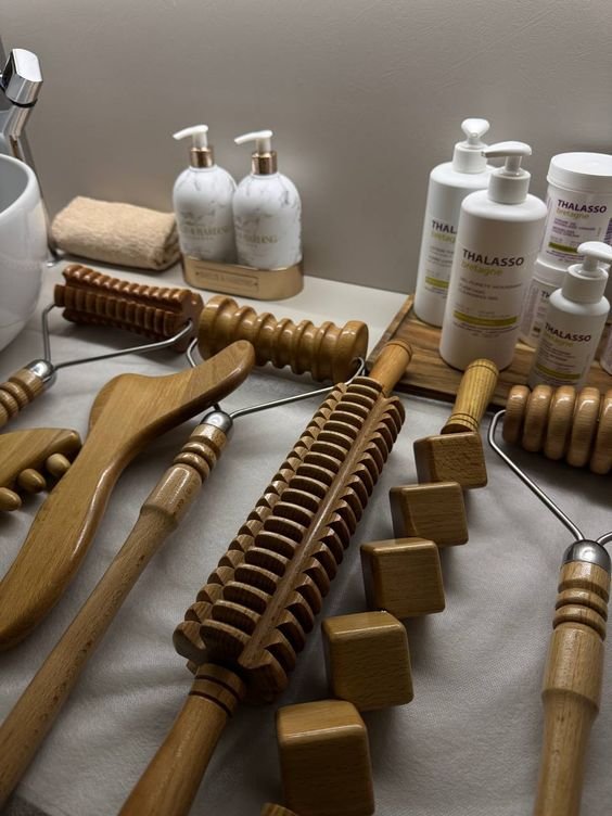 Professional wooden maderotherapy massage tools and body care products laid out at Blossoms Massage Spa, Kilimani