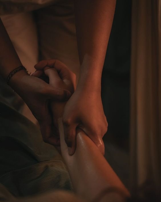 Therapist's hands at work during a massage session at Blossoms Massage Spa, Kilimani
